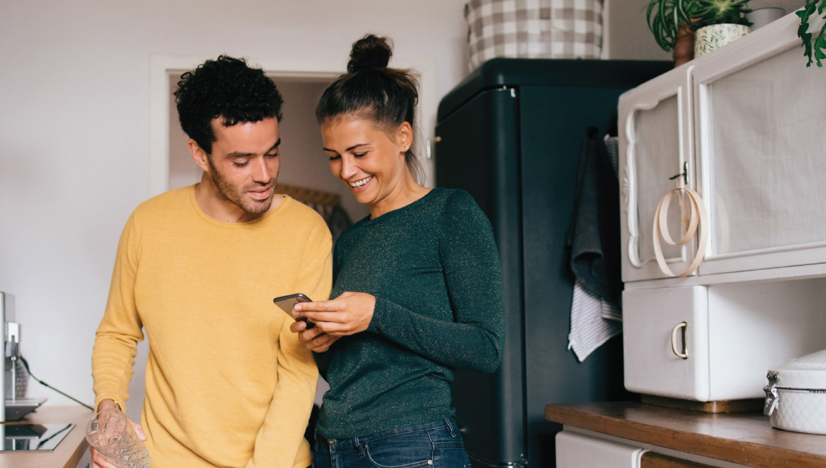 Two people looking at a phone