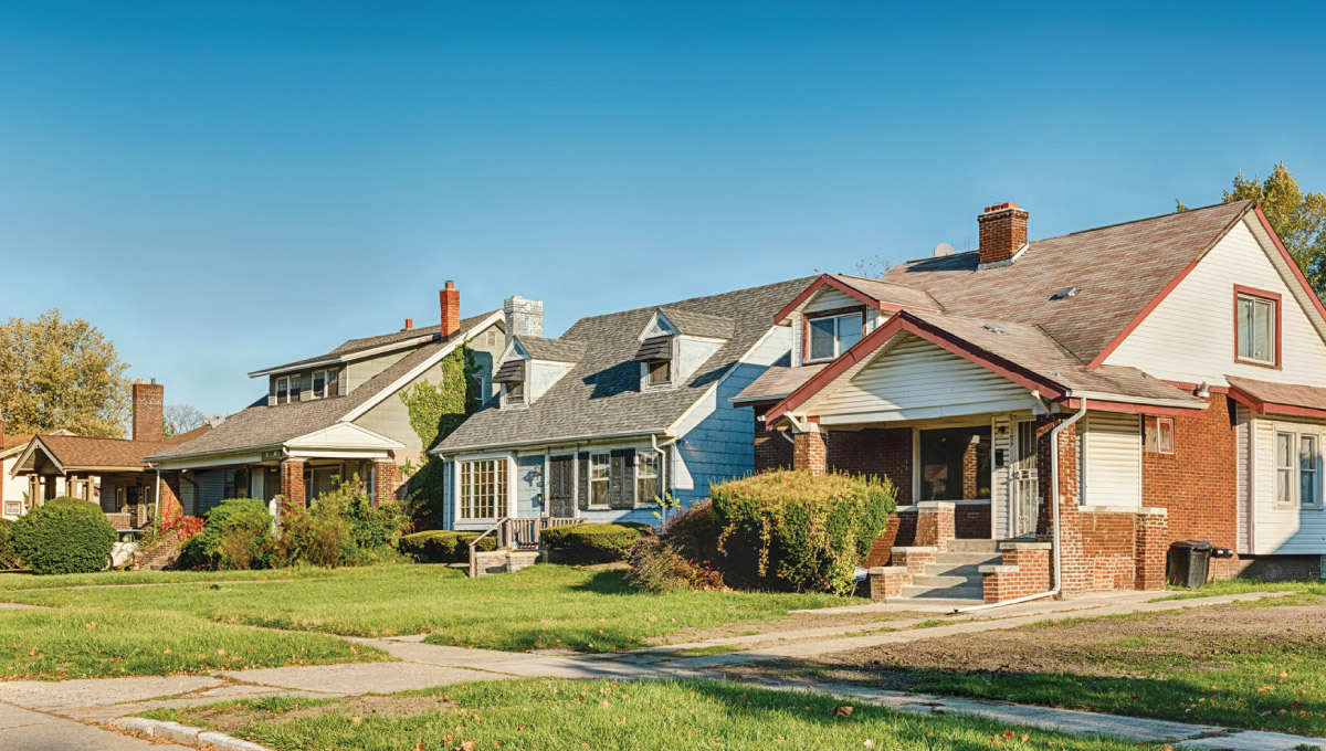 A row of houses with a lawn