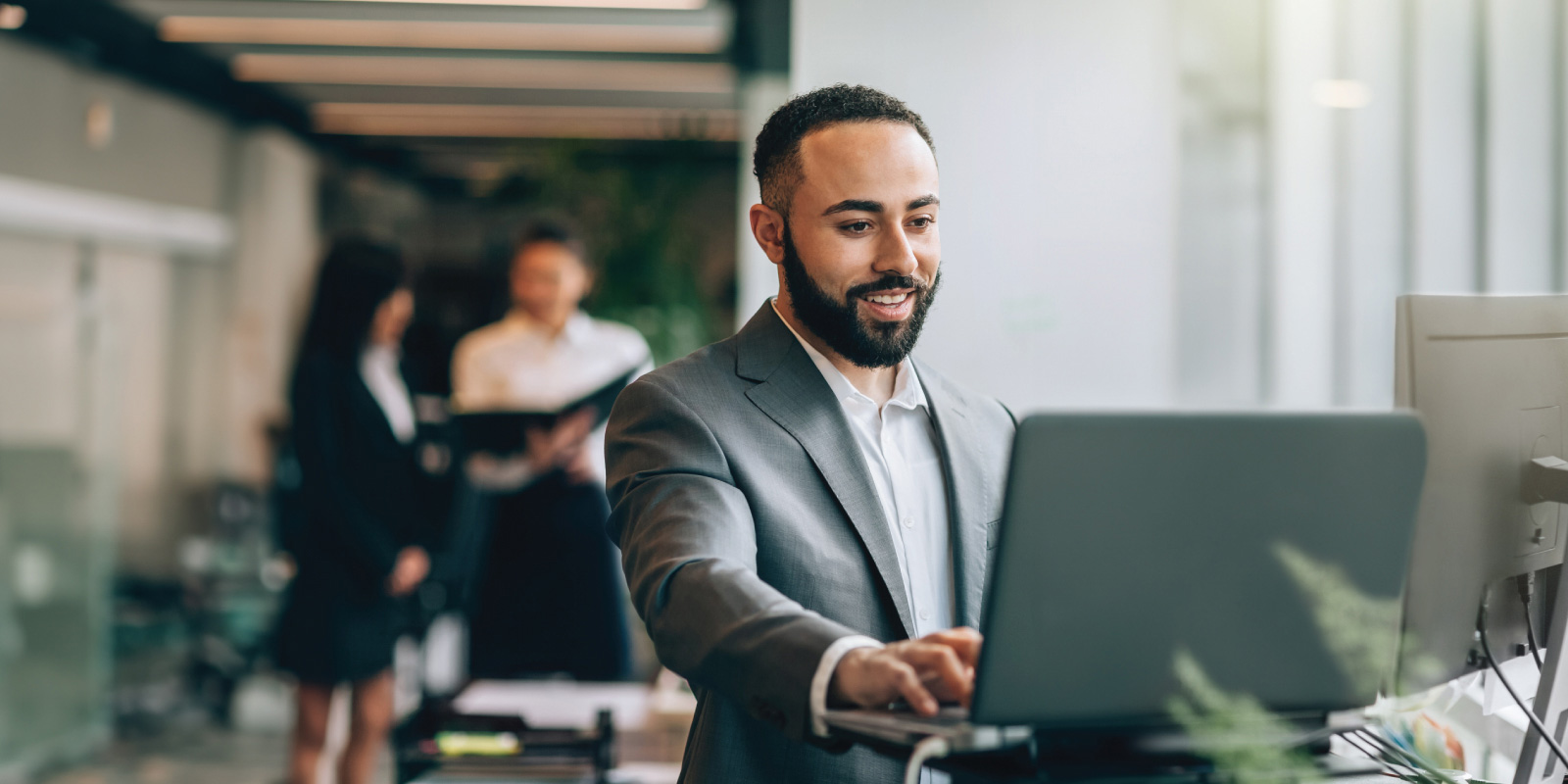 man using a laptop in an office