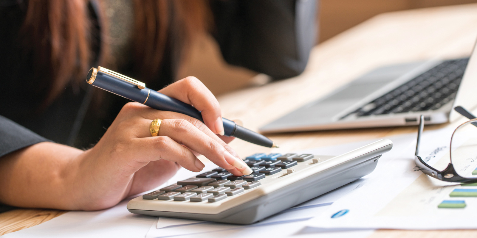 A person using a calculator